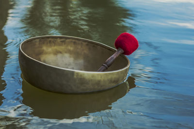 Tibetan singing bowl is floating on water