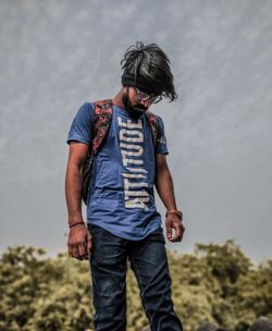 Young man standing on field