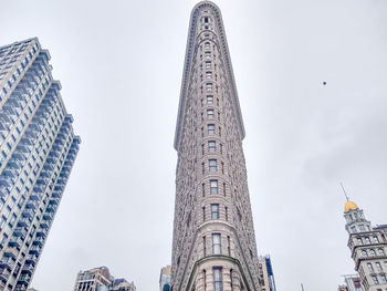 Low angle view of buildings against sky in city