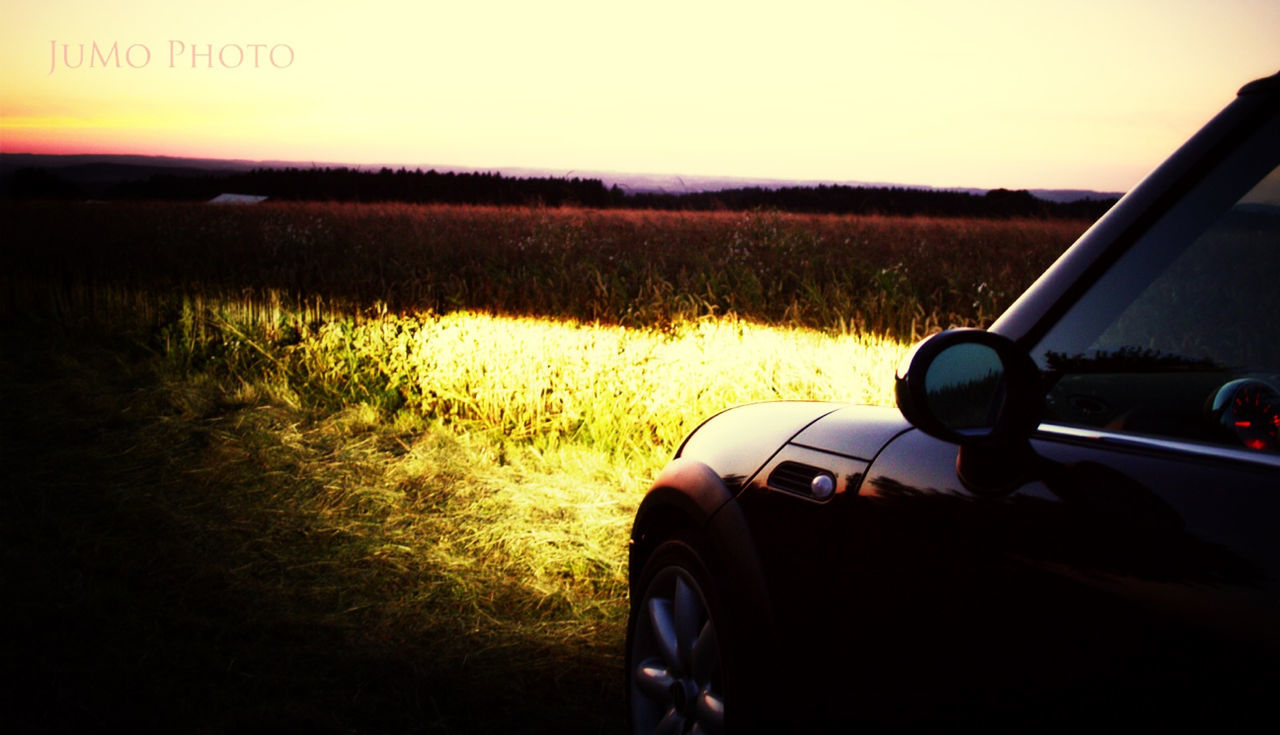 transportation, land vehicle, mode of transport, car, part of, car interior, vehicle interior, travel, cropped, road, landscape, road trip, side-view mirror, field, driving, windshield, sunset, close-up