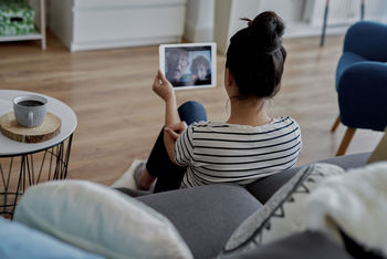 High angle view of woman on video call with grandparents