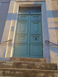 Low angle view of closed door of building