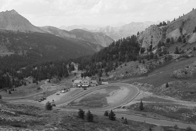 High angle view of road amidst trees against sky