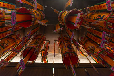 Low angle view of decorations hanging on ceiling of building