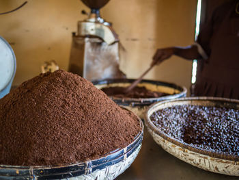 Close-up of ground coffee and coffee beans 