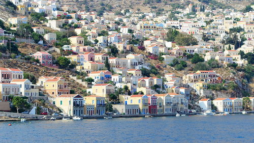 High angle view of townscape by sea