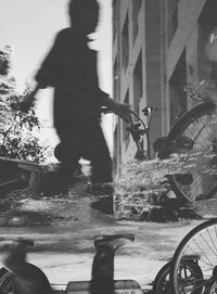 Blurred motion of man on bicycle in city
