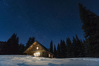 Building against sky at night during winter