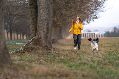 Rear view of woman standing in park