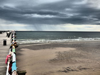 Scenic view of sea against cloudy sky