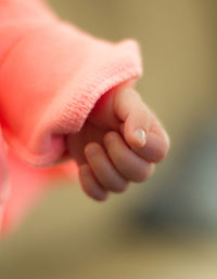 Close-up of hands holding baby hand