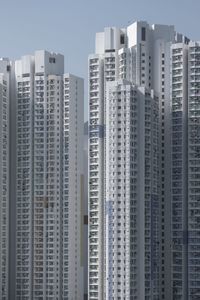 Low angle view of modern buildings against clear sky