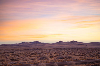 Scenic view of landscape against sky during sunset