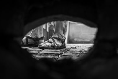 Low section of man standing in cave