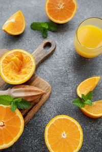 Glass of fresh orange juice with fresh fruits