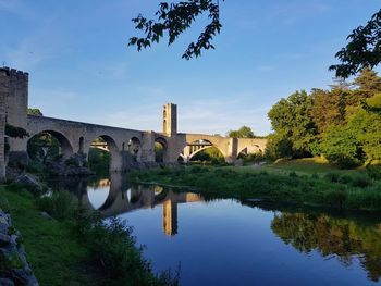 Bridge over river against sky