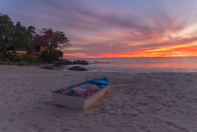 Scenic view of beach against sky during sunset