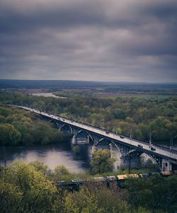 Bridge over river and through a forest 