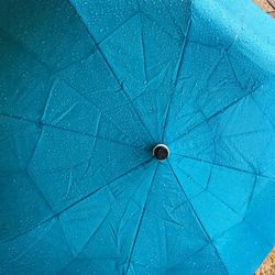 Full frame shot of water drops on umbrella