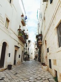 Narrow alley amidst buildings in town