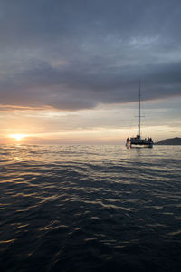 Scenic view of sea against cloudy sky