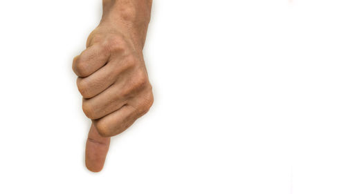 Close-up of human hand holding white background