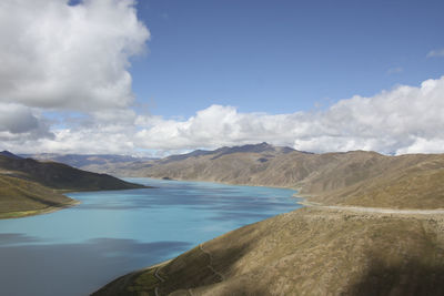 Scenic view of lake and mountains against sky