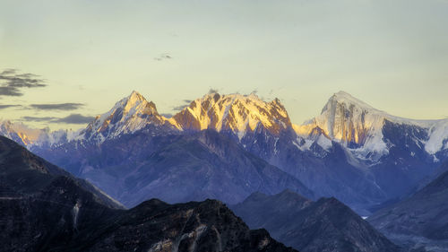 Scenic view of snowcapped mountains against sky