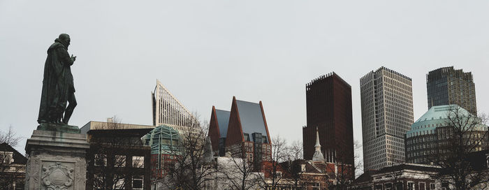 Low angle view of buildings against clear sky