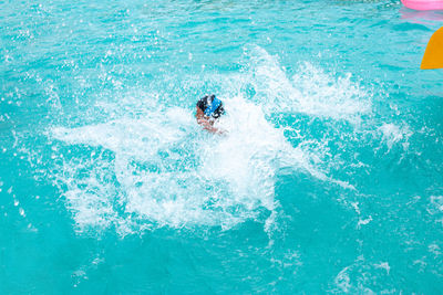 High angle view of man surfing in swimming pool