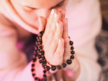 Close-up of woman praying