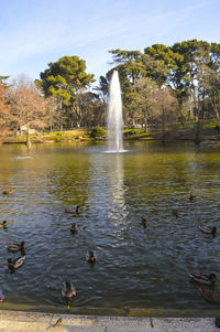 Water splashing in fountain against sky