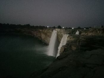 Scenic view of waterfall against clear sky