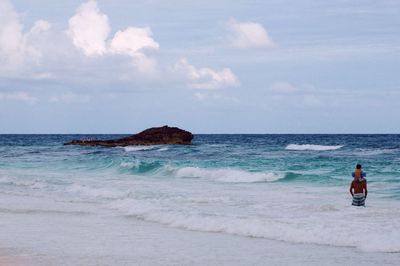 Scenic view of sea against cloudy sky