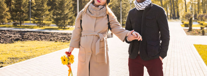 Couple standing in front of woman