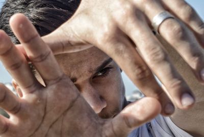 Close-up of teenage boy gesturing