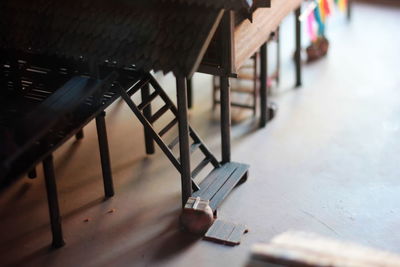 Close-up of empty chairs and table in cafe