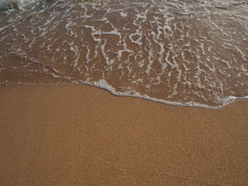 High angle view of surf on beach