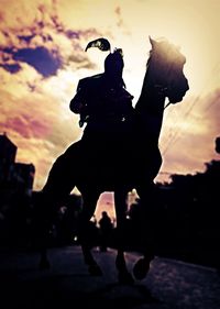 Silhouette of people at sunset