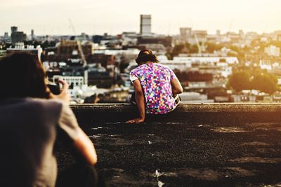 Woman standing on city street