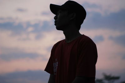 Silhouette of man against sky during sunset