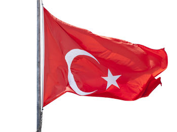 Close-up of red flag against white background