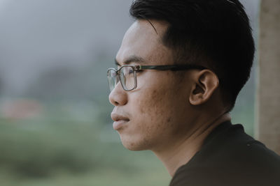 Portrait of a young man looking away