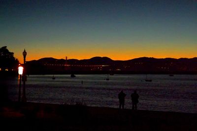 Silhouette of people at dusk