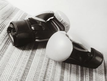 Close-up of boxing gloves on table