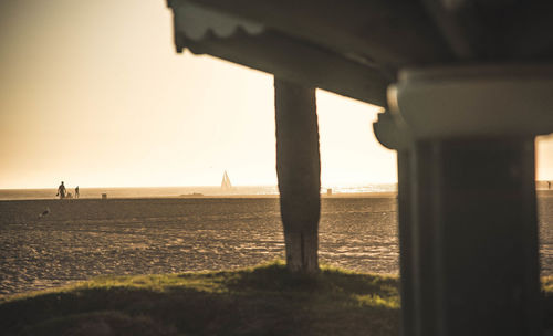 Scenic view of sea against clear sky during sunset