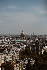 Aerial view of city buildings against sky
