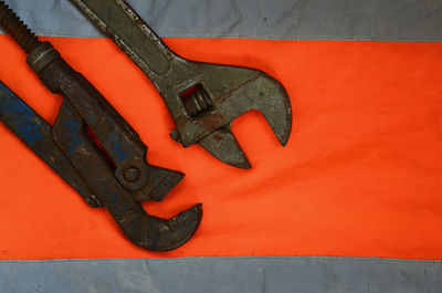 Close-up of work tools on reflective clothes