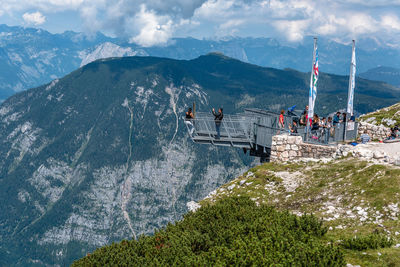 Overhead cable car on mountain against sky