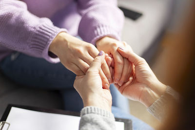 Cropped image of doctor examining patient